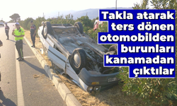 Takla atarak ters dönen otomobilden burunları kanamadan çıktılar