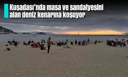 Kuşadası’nda masa ve sandalyesini alan deniz kenarına koşuyor
