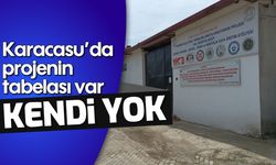 Karacasu'da projenin tabelası var, kendi yok