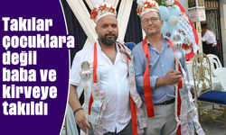 Takılar çocuklara değil baba ve kirveye takıldı