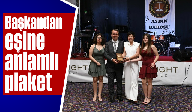 Başkandan eşine anlamlı plaket
