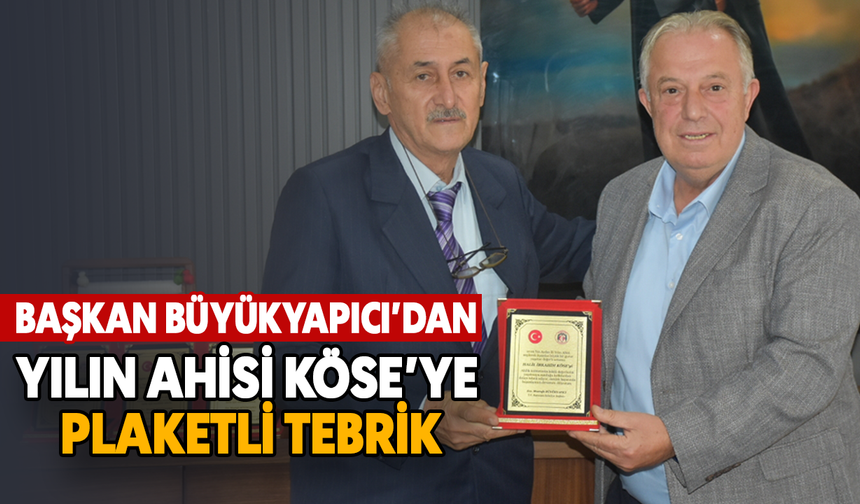 Başkan Büyükyapıcı'dan yılın ahisi Köse'ye plaketli tebrik
