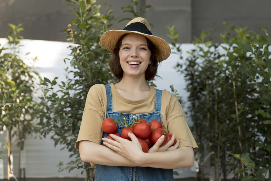female-farmer-holding-some-tomatoes.jpg